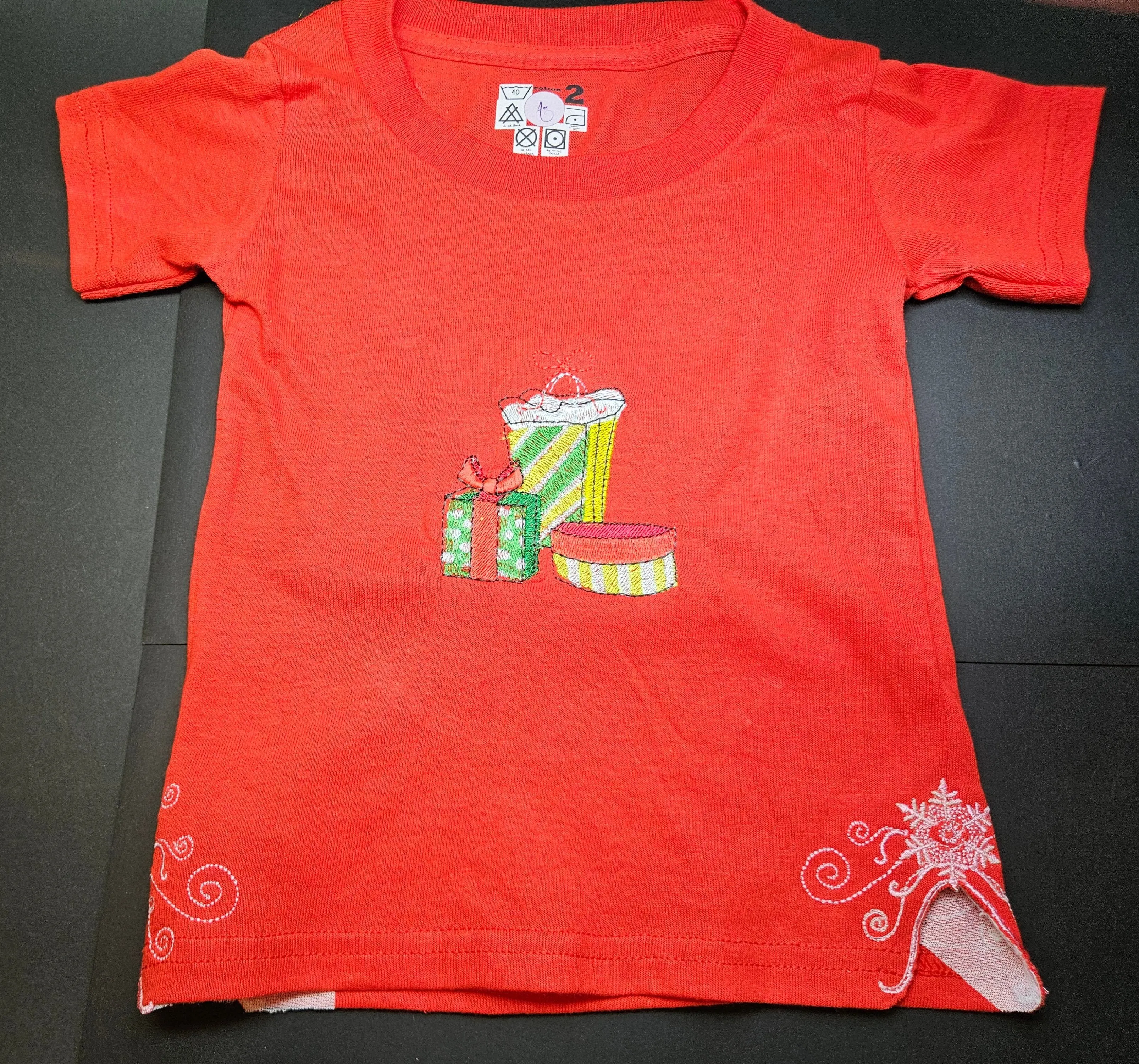 Christmas Presents embroidered, and Trendy Embroidered Sides on Red T-Shirts for Toddlers. Comfortable, soft Tees.