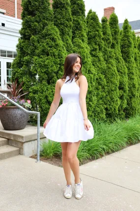 SMOCKED HALTER MINI DRESS IN WHITE